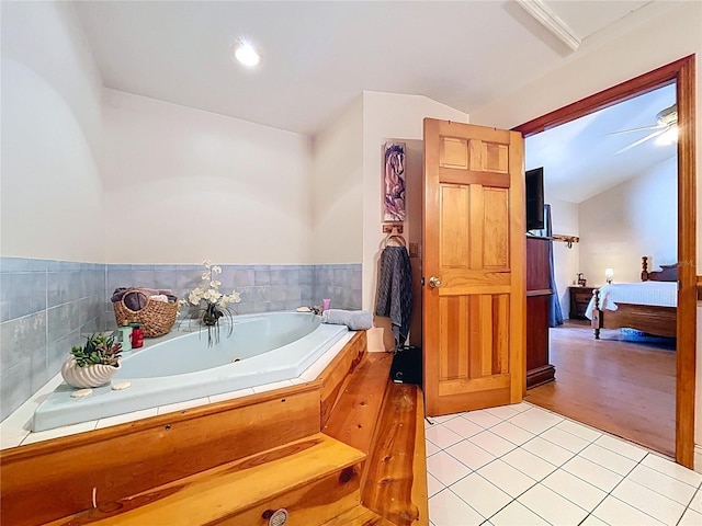 13341 Hexam Rd, Weeki Wachee, FL 34613 - ensuite bathroom featuring a whirlpool tub, tile patterned floors, and vaulted ceiling