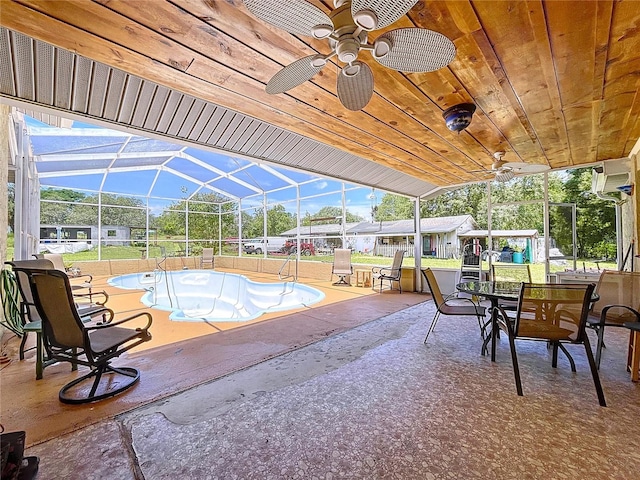 13341 Hexam Rd, Weeki Wachee, FL 34613 - view of swimming pool featuring a ceiling fan, a patio area, a lanai, and outdoor dining area