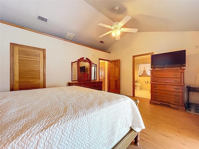 13341 Hexam Rd, Weeki Wachee, FL 34613 - bedroom featuring wood finished floors, connected bathroom, a ceiling fan, and high vaulted ceiling