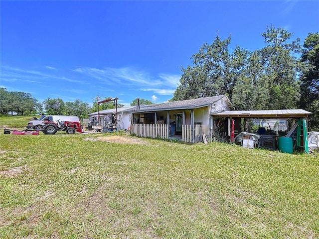 13341 Hexam Rd, Weeki Wachee, FL 34613 - view of front of house featuring a front yard and a carport