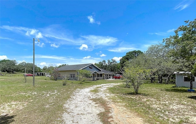 13341 Hexam Rd, Weeki Wachee, FL 34613 - view of front of home with driveway and a front lawn