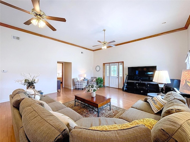 13341 Hexam Rd, Weeki Wachee, FL 34613 - living area with a ceiling fan, light wood-style floors, and ornamental molding