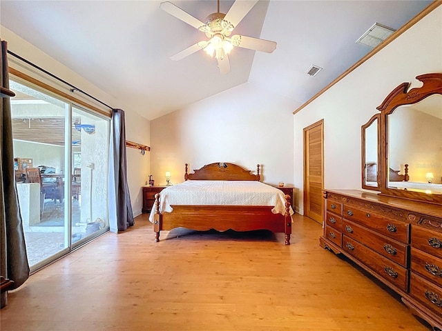13341 Hexam Rd, Weeki Wachee, FL 34613 - bedroom with access to outside, vaulted ceiling, light wood-style flooring, multiple windows, and ceiling fan