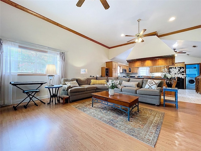 13341 Hexam Rd, Weeki Wachee, FL 34613 - living room featuring ceiling fan, washer / clothes dryer, plenty of natural light, crown molding, and vaulted ceiling
