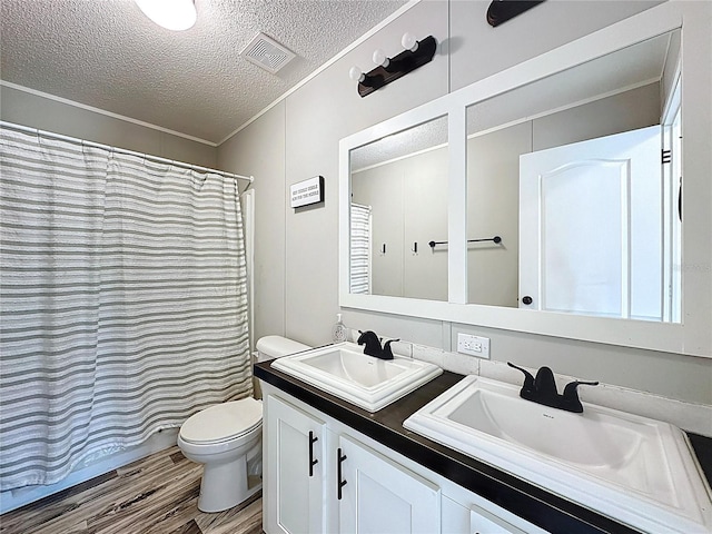 8851 C 469, Center Hill, FL 33514 - bathroom with a textured ceiling, double vanity, wood finished floors, crown molding, and a shower with curtain