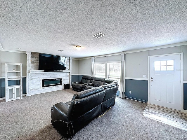 8851 C 469, Center Hill, FL 33514 - carpeted living area with a large fireplace and a textured ceiling