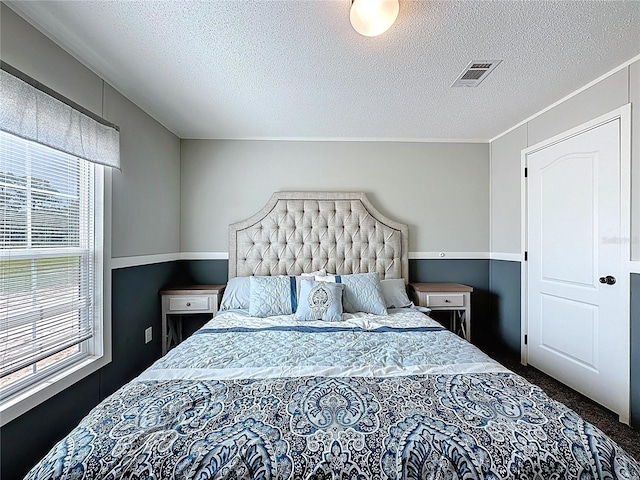 8851 C 469, Center Hill, FL 33514 - carpeted bedroom with a textured ceiling