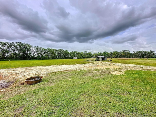 8851 C 469, Center Hill, FL 33514 - view of green lawn featuring a view of countryside and a carport