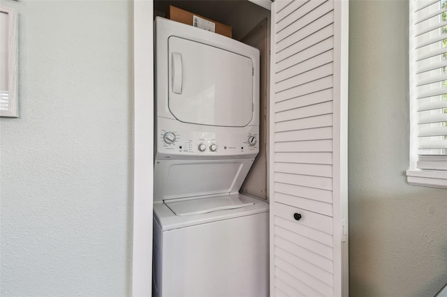 1529 Essex Dr N, Saint Petersburg, FL 33710 - laundry room with estacked washer and dryer and a textured wall