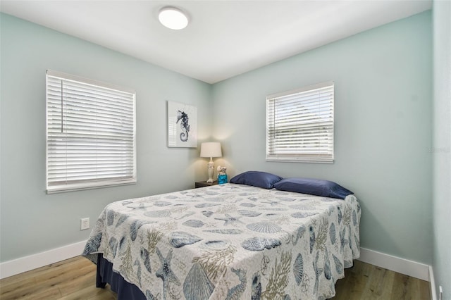 1529 Essex Dr N, Saint Petersburg, FL 33710 - bedroom with baseboards and wood finished floors