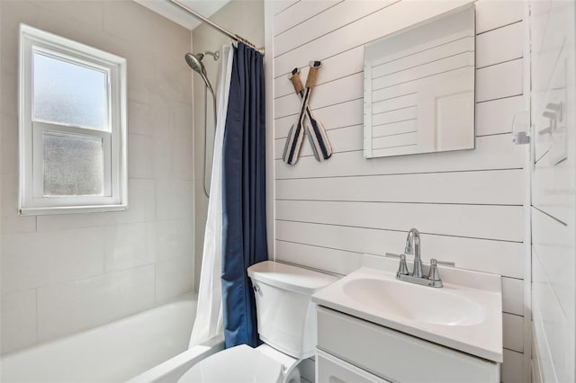1529 Essex Dr N, Saint Petersburg, FL 33710 - bathroom featuring toilet, shower / tub combo with curtain, vanity, and wood walls