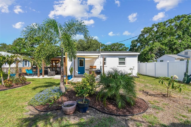 1529 Essex Dr N, Saint Petersburg, FL 33710 - rear view of house with stucco siding and a patio area