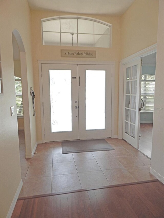 5815 Heronview Crescent Dr, Lithia, FL 33547 - foyer entrance with french doors, plenty of natural light, and arched walkways
