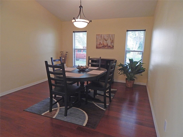 5815 Heronview Crescent Dr, Lithia, FL 33547 - dining space featuring wood finished floors, baseboards, and vaulted ceiling
