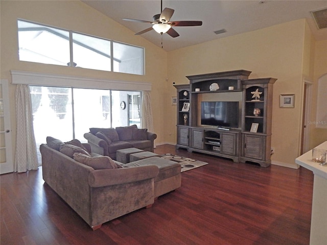 5815 Heronview Crescent Dr, Lithia, FL 33547 - living room featuring dark wood-style flooring, ceiling fan, high vaulted ceiling, and baseboards