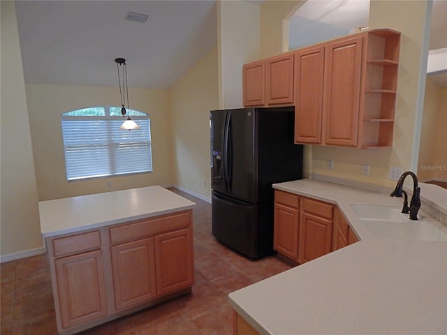 5815 Heronview Crescent Dr, Lithia, FL 33547 - kitchen with black refrigerator with ice dispenser, a sink, vaulted ceiling, open shelves, and light tile patterned floors