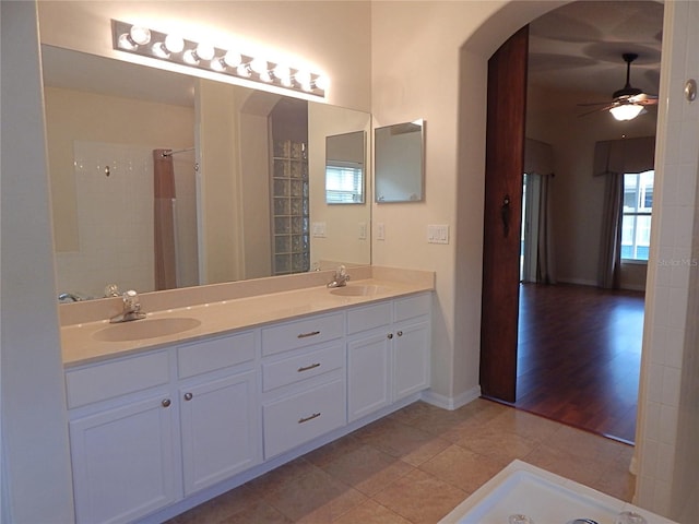 5815 Heronview Crescent Dr, Lithia, FL 33547 - bathroom featuring ceiling fan, double vanity, tile patterned flooring, and baseboards