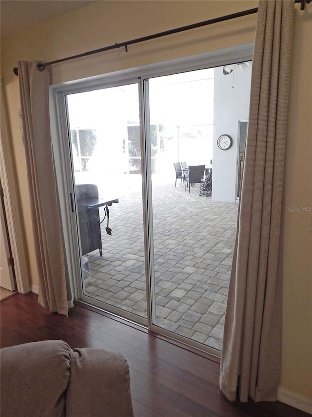 5815 Heronview Crescent Dr, Lithia, FL 33547 - doorway to outside featuring wood finished floors