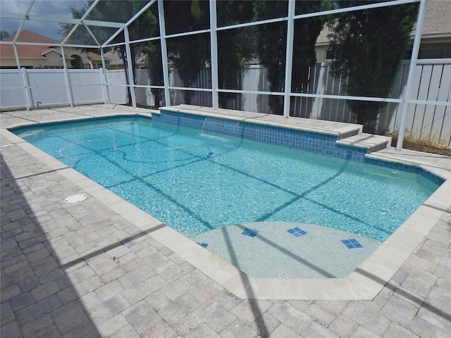5815 Heronview Crescent Dr, Lithia, FL 33547 - view of swimming pool featuring a fenced backyard, glass enclosure, and a patio