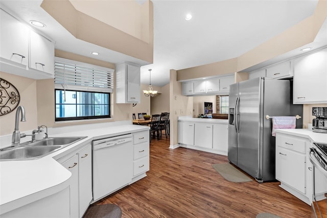 2921 SE 38th Pl, Ocala, FL 34480 - kitchen with white dishwasher, a chandelier, dark wood-type flooring, stainless steel refrigerator with ice dispenser, and white cabinets