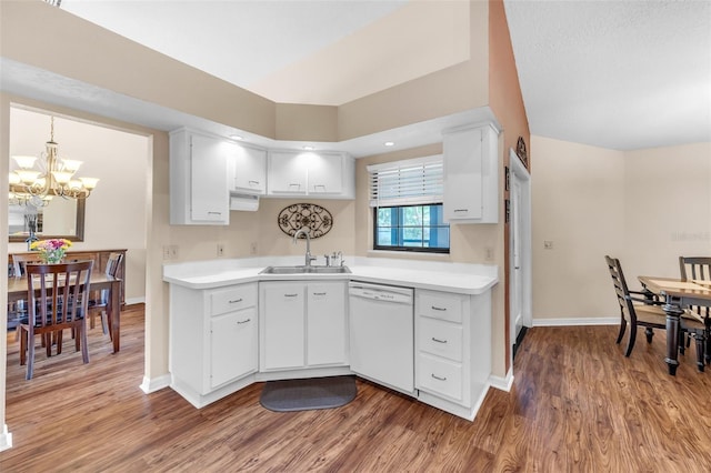 2921 SE 38th Pl, Ocala, FL 34480 - kitchen with dishwasher, a chandelier, light wood finished floors, and light countertops