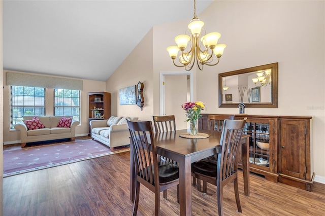 2921 SE 38th Pl, Ocala, FL 34480 - dining room with high vaulted ceiling, a chandelier, and wood finished floors