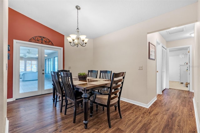 2921 SE 38th Pl, Ocala, FL 34480 - dining space featuring wood finished floors, a chandelier, and french doors