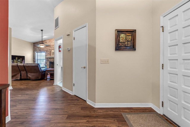 2921 SE 38th Pl, Ocala, FL 34480 - entrance foyer with dark wood finished floors, a ceiling fan, and a fireplace