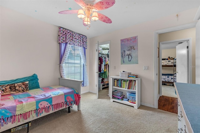 2921 SE 38th Pl, Ocala, FL 34480 - carpeted bedroom featuring a closet, a ceiling fan, and a spacious closet
