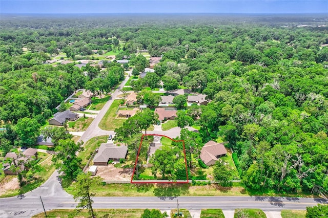 2921 SE 38th Pl, Ocala, FL 34480 - aerial perspective of suburban area with a heavily wooded area and property parcel outlined