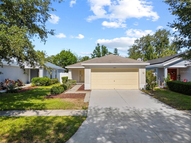 11363 Cocoa Beach Dr, Riverview, FL 33569 - ranch-style house featuring stucco siding, concrete driveway, a garage, and a front yard