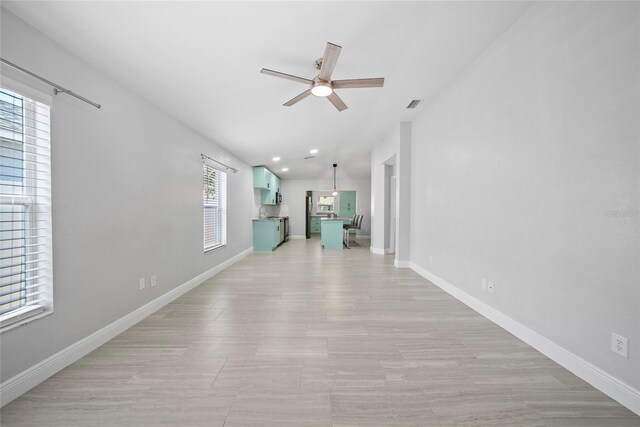11363 Cocoa Beach Dr, Riverview, FL 33569 - unfurnished living room featuring ceiling fan, baseboards, and recessed lighting