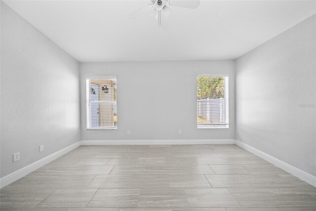 11363 Cocoa Beach Dr, Riverview, FL 33569 - spare room featuring ceiling fan and baseboards