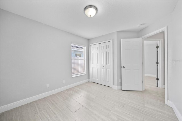 11363 Cocoa Beach Dr, Riverview, FL 33569 - unfurnished bedroom with baseboards and a closet