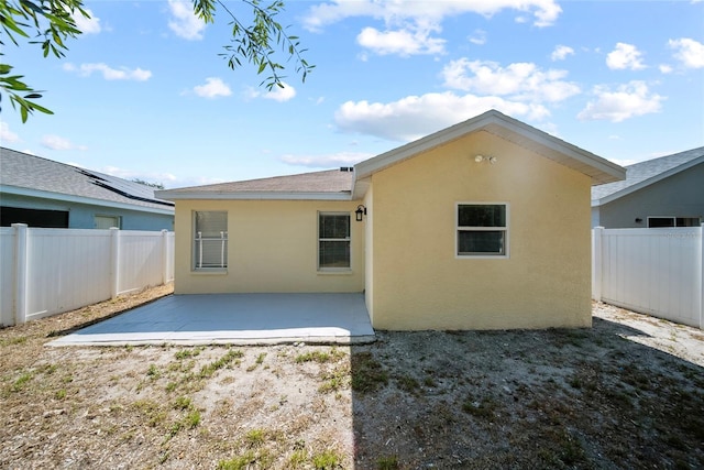 11363 Cocoa Beach Dr, Riverview, FL 33569 - rear view of property featuring stucco siding, a patio, and a fenced backyard