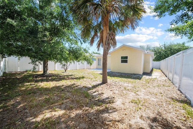 11363 Cocoa Beach Dr, Riverview, FL 33569 - fenced backyard with a patio area