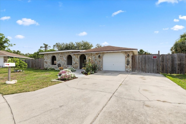 8918 Carmen Ln, Port Richey, FL 34668 - view of front facade with stone siding, a garage, and concrete driveway