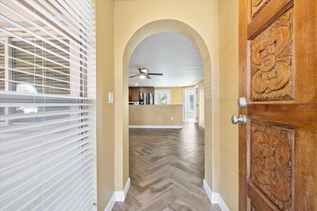 8918 Carmen Ln, Port Richey, FL 34668 - entryway with baseboards, arched walkways, and a ceiling fan