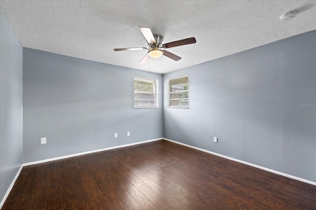 8918 Carmen Ln, Port Richey, FL 34668 - empty room featuring wood finished floors, a ceiling fan, baseboards, a textured ceiling, and a smoke detector