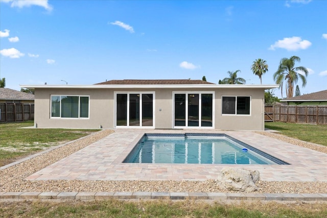 8918 Carmen Ln, Port Richey, FL 34668 - rear view of property featuring stucco siding and a patio