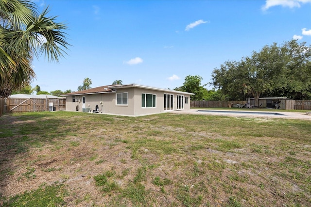 8918 Carmen Ln, Port Richey, FL 34668 - rear view of property with stucco siding