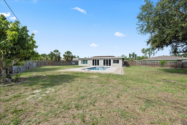 8918 Carmen Ln, Port Richey, FL 34668 - back of property with a patio area and stucco siding