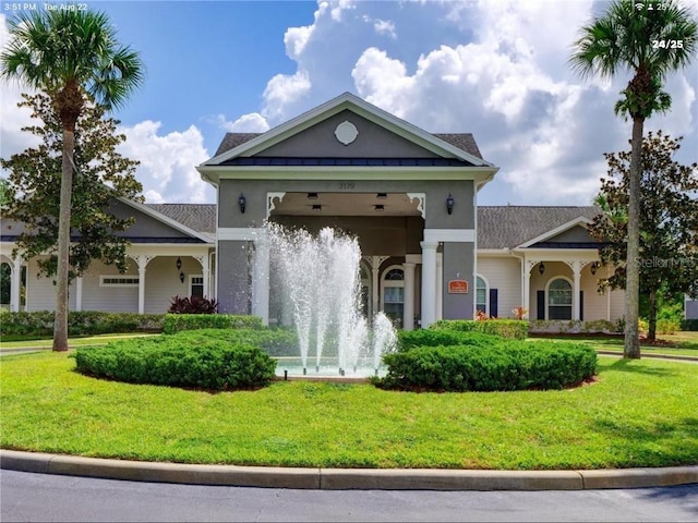 3175 Feltrim Pl Unit 405, Kissimmee, FL 34747 - view of front facade featuring a front lawn and stucco siding