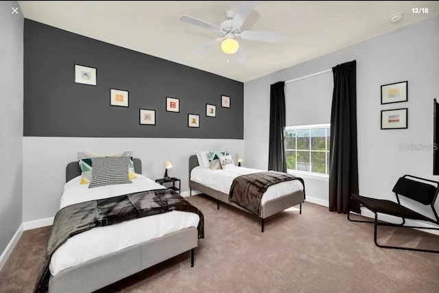 3175 Feltrim Pl Unit 405, Kissimmee, FL 34747 - carpeted bedroom with baseboards and a ceiling fan
