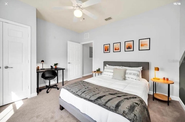 3175 Feltrim Pl Unit 405, Kissimmee, FL 34747 - bedroom with light carpet, ceiling fan, a desk, and electric panel