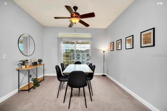 3175 Feltrim Pl Unit 405, Kissimmee, FL 34747 - carpeted dining area with a ceiling fan and baseboards