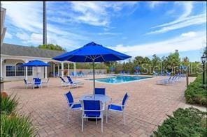 3175 Feltrim Pl Unit 405, Kissimmee, FL 34747 - community pool featuring a patio area