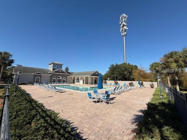3175 Feltrim Pl Unit 405, Kissimmee, FL 34747 - community pool featuring a patio