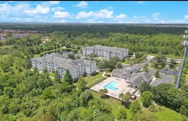 3175 Feltrim Pl Unit 405, Kissimmee, FL 34747 - aerial view of a pool area and a forest