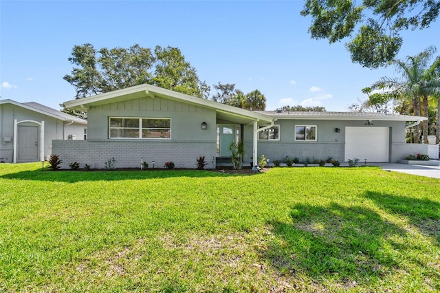 94 Nicholas Dr, Dunedin, FL 34698 - ranch-style home featuring an attached garage, brick siding, a front yard, and driveway